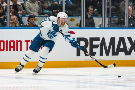 Jan 31, 2026; Vancouver, British Columbia, CAN; Toronto Maple Leafs defenseman Morgan Rielly (44) makes a pass against the Vancouver Canucks in the second period at Rogers Arena. Mandatory Credit: Bob Frid-Imagn Images