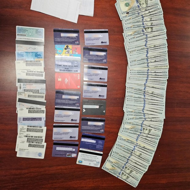 The more than $15,000 in cash as well as fraudulent identification cards and credit cards recovered by police. (Sonoma Sheriff)
