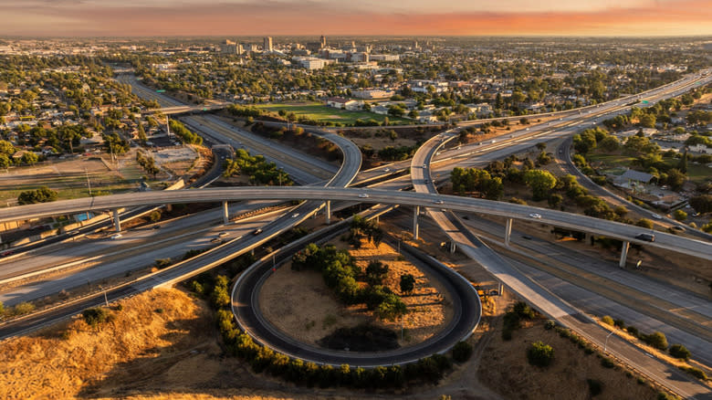 Aerial view of a freeway interchange at sunset in Fresno, near Reedley