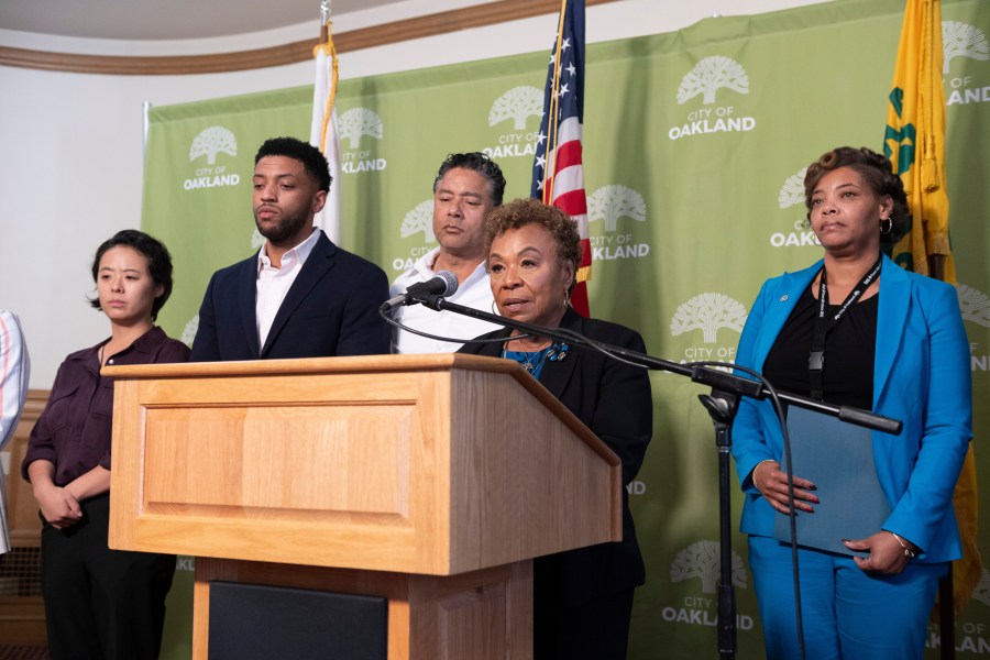 Oakland Mayor Barbara Lee, center, speaks during a press conference about public safety, a day after football coach John Beam was shot at Laney College, on Friday, Nov. 14, 2025, in Oakland, Calif. (AP Photo/Laure Andrillon)