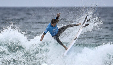 Man Surfing Through Long Beach Streets During Heavy Flooding