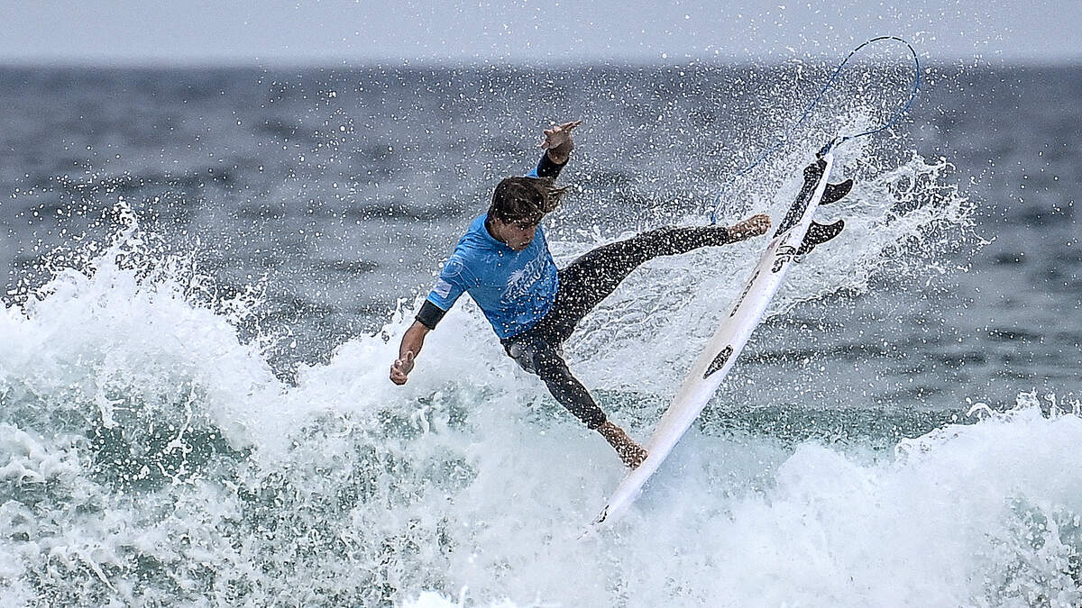 Man Surfing Through Long Beach Streets During Heavy Flooding