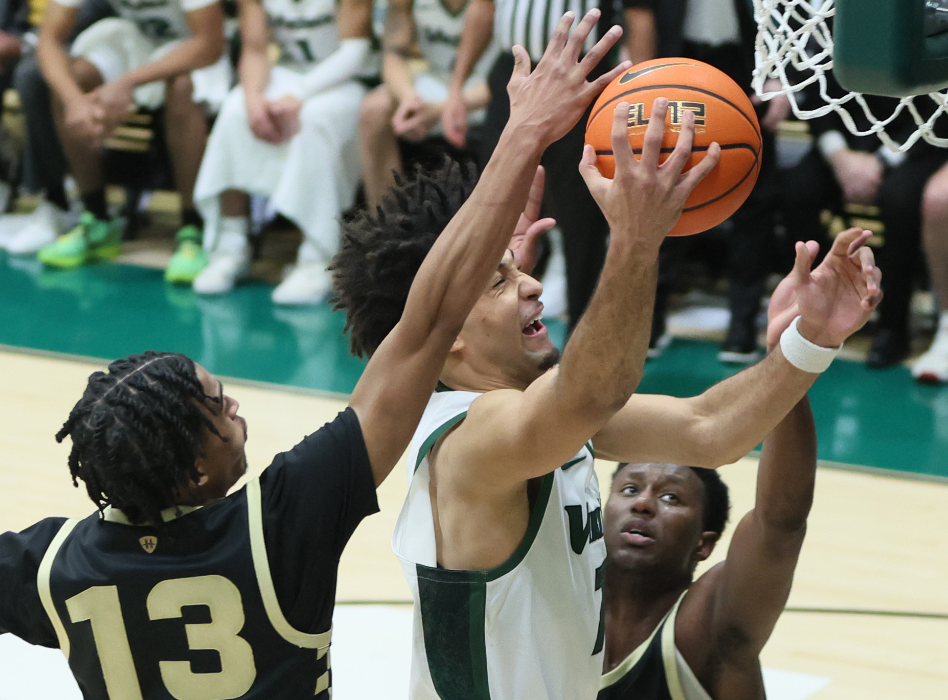 Cleveland State Vikings forward Dayan Nessah has his layup attempt deflected by the defense of Oakland Golden Grizzlies guard Warren Marshall IV in the second half.  