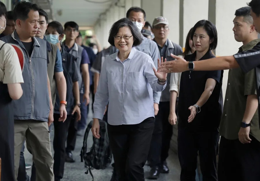 Former Taiwan President Tsai Ing-wen, center, waves to medias in Taipei, Taiwan, Saturday, July 26, 2025. (AP Photo/Chiang Ying-ying)