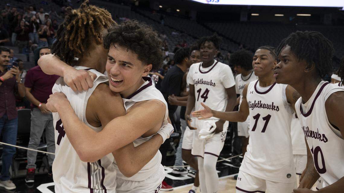 The Natomas Nighthawks celebrate after winning the CIF Sac-Joaquin Section Division IV boys basketball championship at Golden 1 Center in Sacramento on Friday.