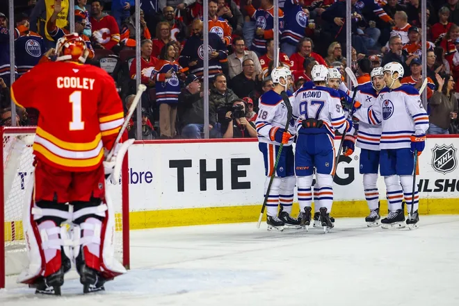 Feb 4, 2026; Calgary, Alberta, CAN; Edmonton Oilers center Leon Draisaitl (29) celebrates his goal with teammates against Calgary Flames goaltender Devin Cooley (1) during the first period at Scotiabank Saddledome.