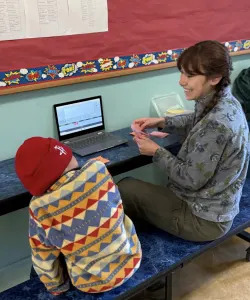 Reading tutor Lillie Reynaga works with a student at Leonard Flynn Elementary School (San Francisco Education Fund) 