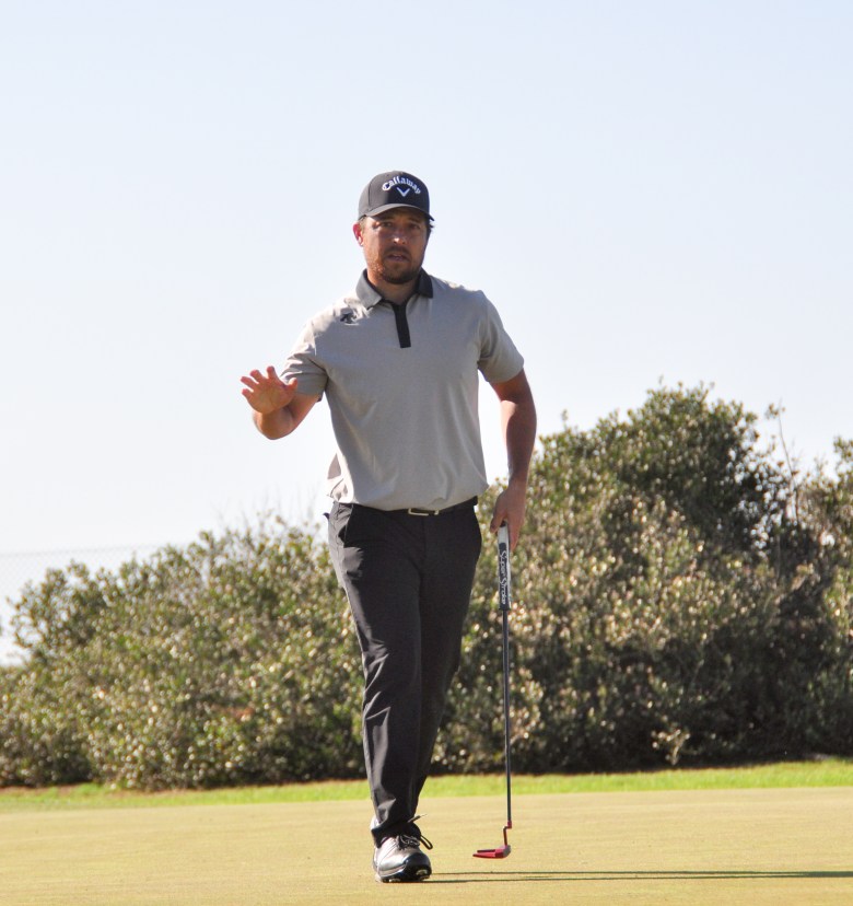 Xander Schauffele acknowledges the gallery after a sinking a long putt for a birdie on hole No. 4 of the North Course at Torrey Pines on Friday, Jan. 30. (Photo by Thomas Melville/Times of San Diego)