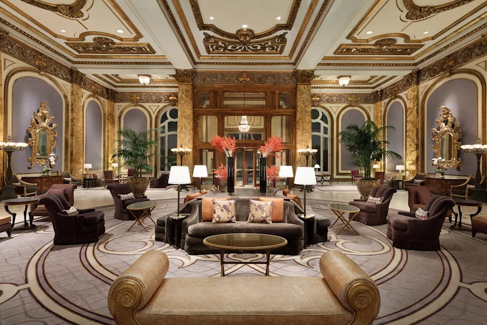 Luxurious lobby with elegant seating and ornate decor.