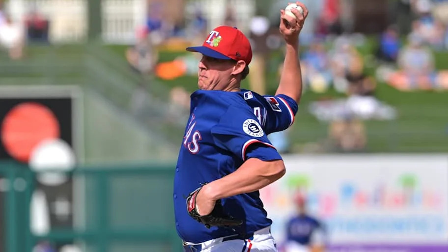 Texas Rangers pitcher Trey Supak throws a baseball.