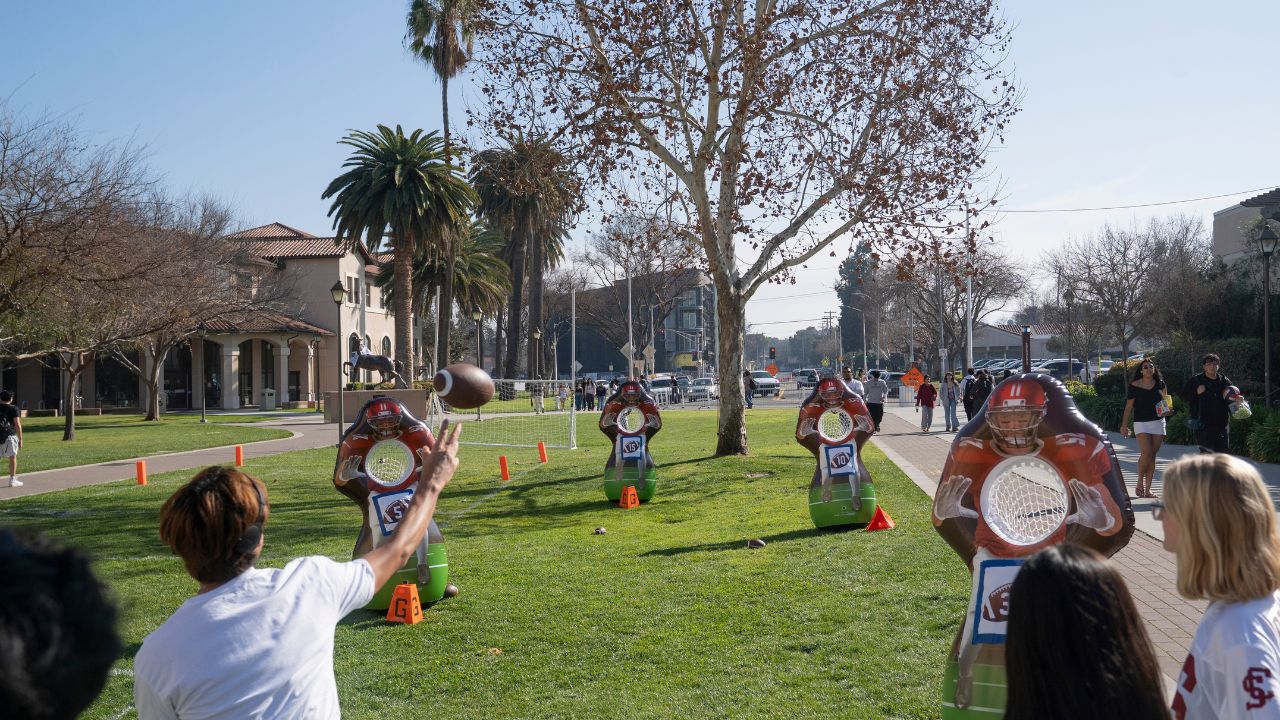 A student throws a football at passing targets during Super Bowl-themed activities on the campus in Santa Clara, Calif., Feb. 5, 2026. Media and internet mentions of Sunday’s Super Bowl LX almost always place the game in San Francisco, but the hosting Levi’s Stadium , home of the 49ers, is actually 45 miles to the south in the suburban Silicon Valley city of Santa Clara, Calif., adjacent to San Jose. (Minh Connors/The New York Times)