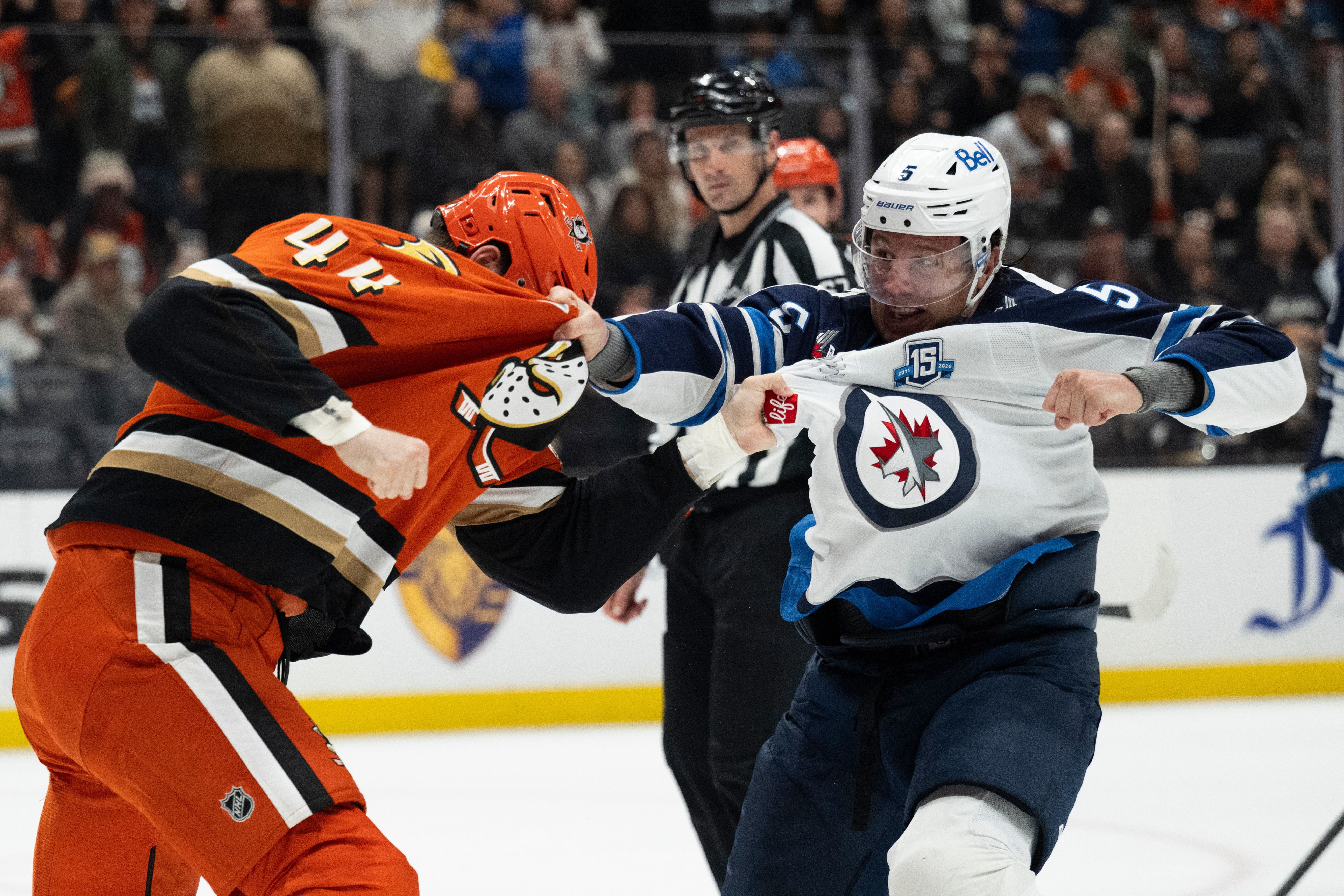 Winnipeg Jets defenseman Luke Schenn, right, fights Ducks left wing...