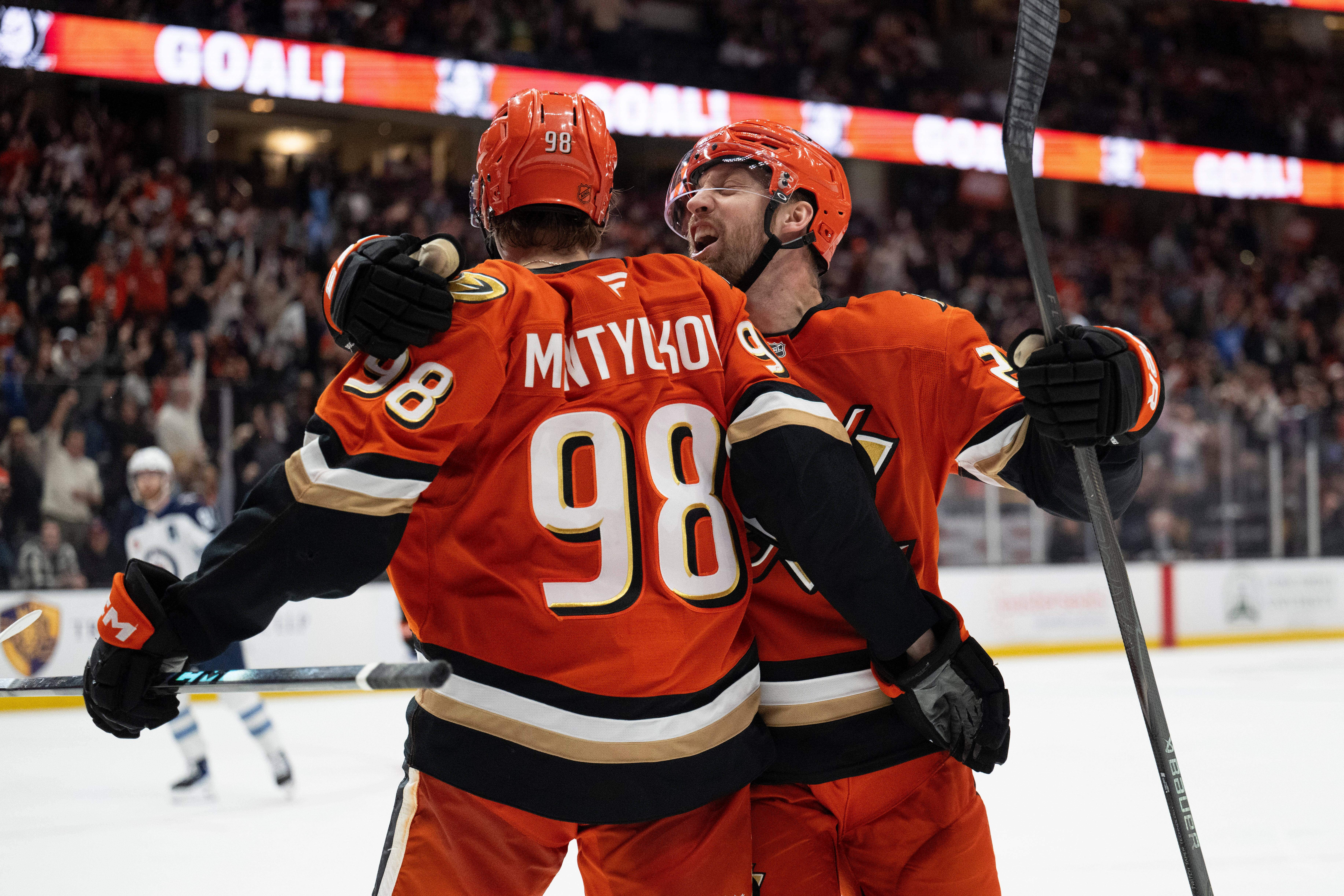 Ducks left wing Jeffrey Viel, right, celebrates a goal by...