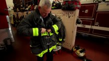 San Francisco firefighter Adam Wood puts on his new type of protective gear, which was manufactured without the use of so-called 'PFAS' chemicals.  The new line of clothing is currently being tested at fire departments across four U.S. cities and Ottawa, Canada.