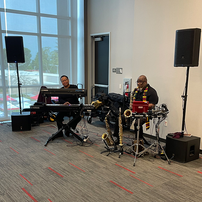 two men playing musical instruments