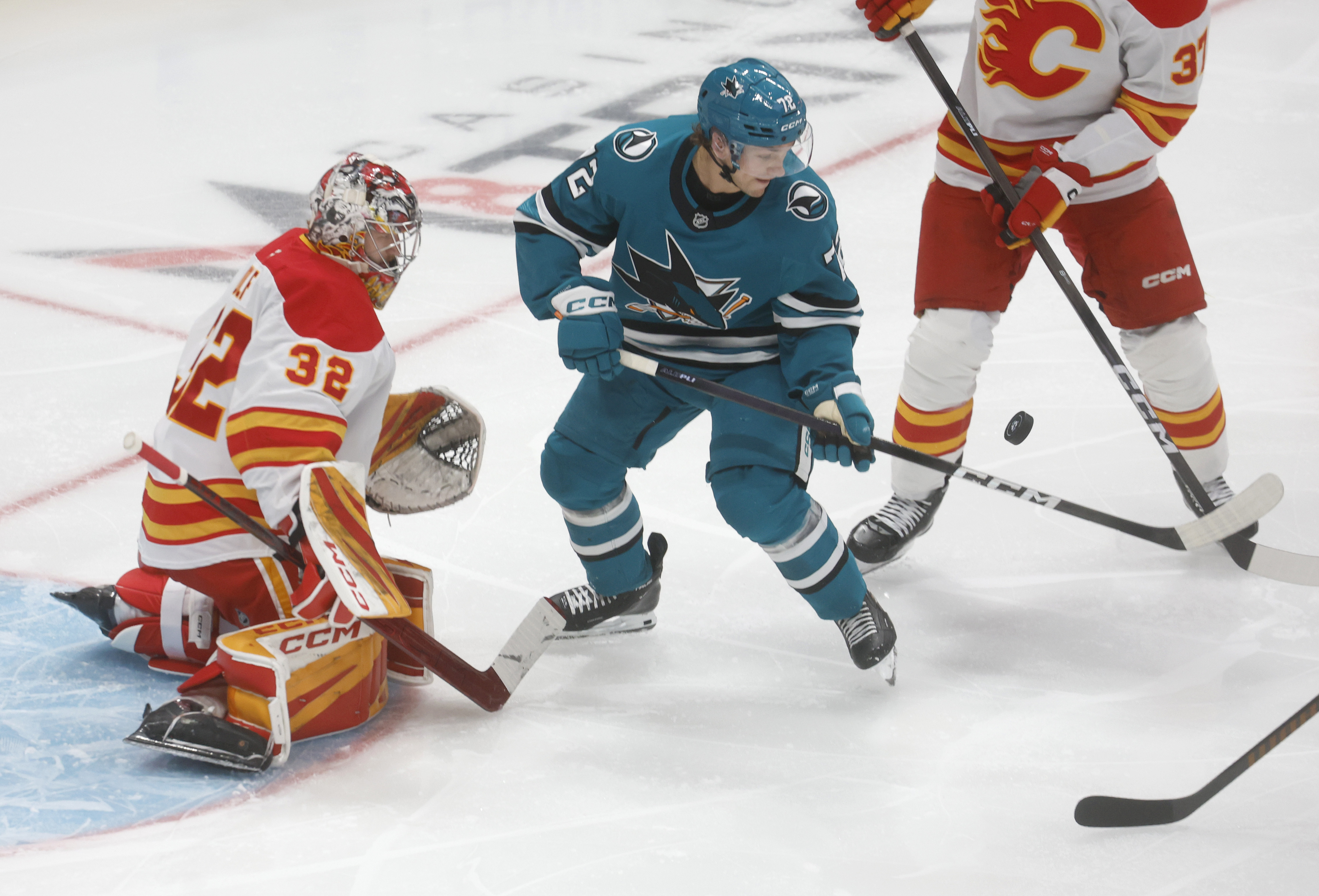San Jose Sharks’ William Eklund (72) fights for the puck...