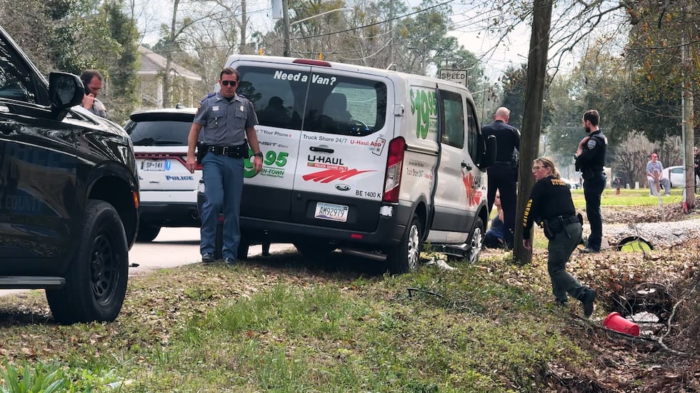 Sheriff deputies and state troopers securing the U-Haul van that fled from Slidell, LA.