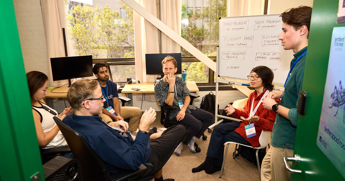 A digital wireframe human face on the right merges with an abstract circuit board design on the left, symbolizing the connection between technology and humanity.