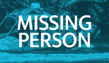 Missing person incident depicts emergency personnel in boat on water