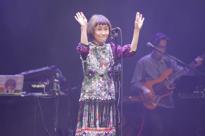 Artist waving her hands
