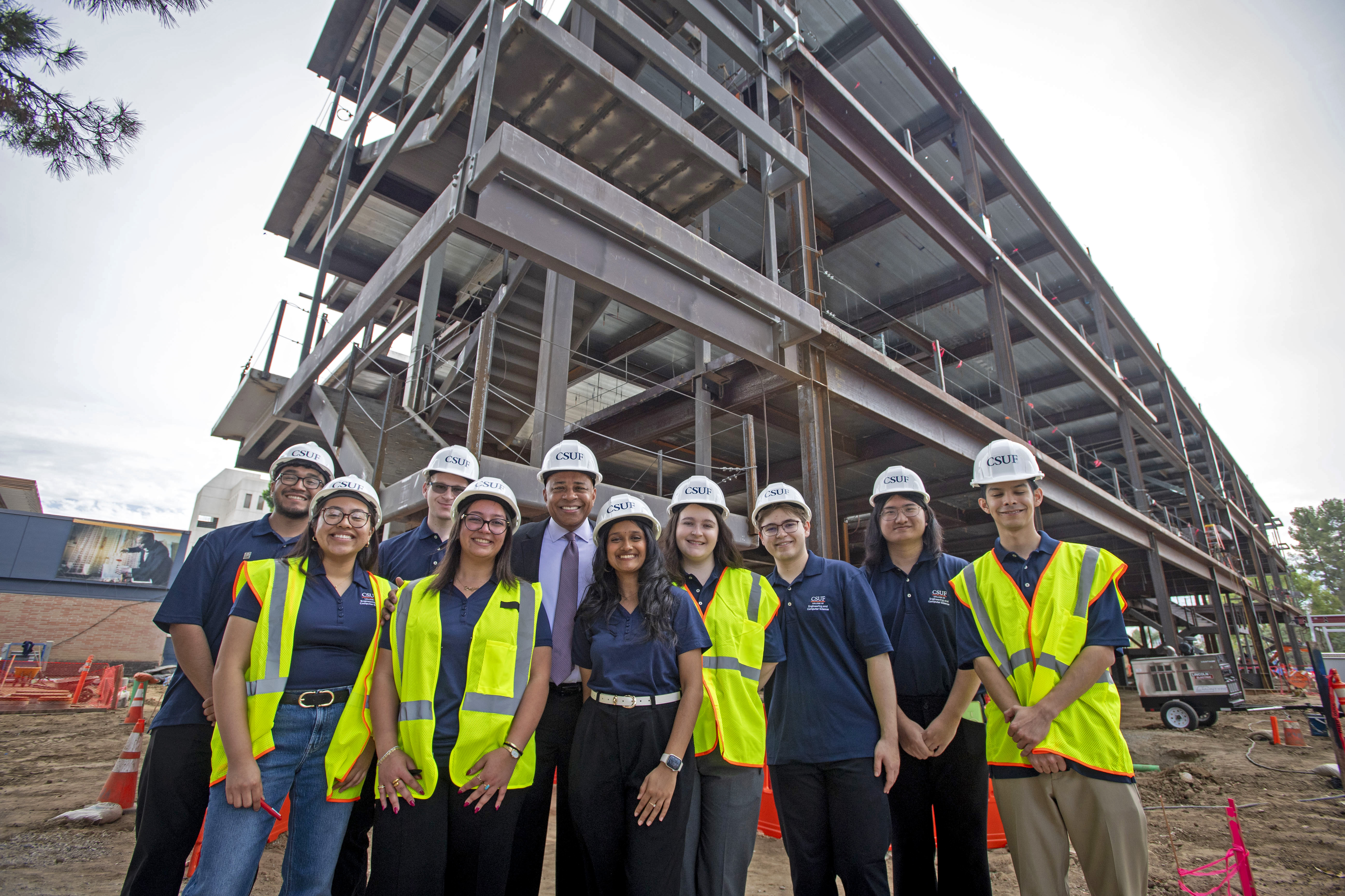 CSUF President Ronald Rochon with the student volunteers at the...