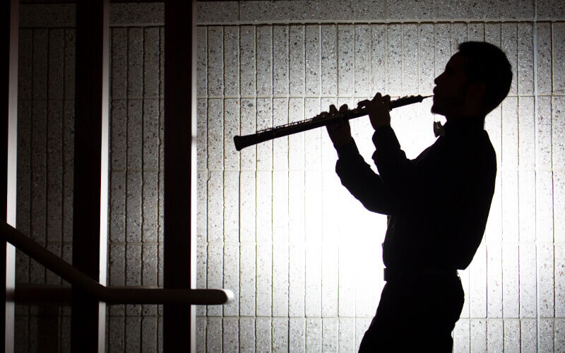Silhouette of oboe player