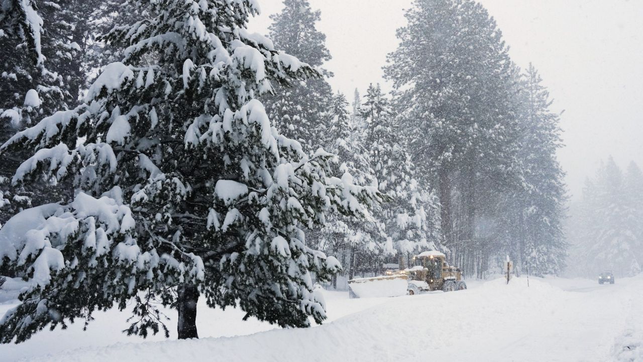 A road is plowed during a snow storm on Tuesday, Feb. 17, 2026 in Truckee Calif. (AP Photos/Brooke Hess-Homeier)