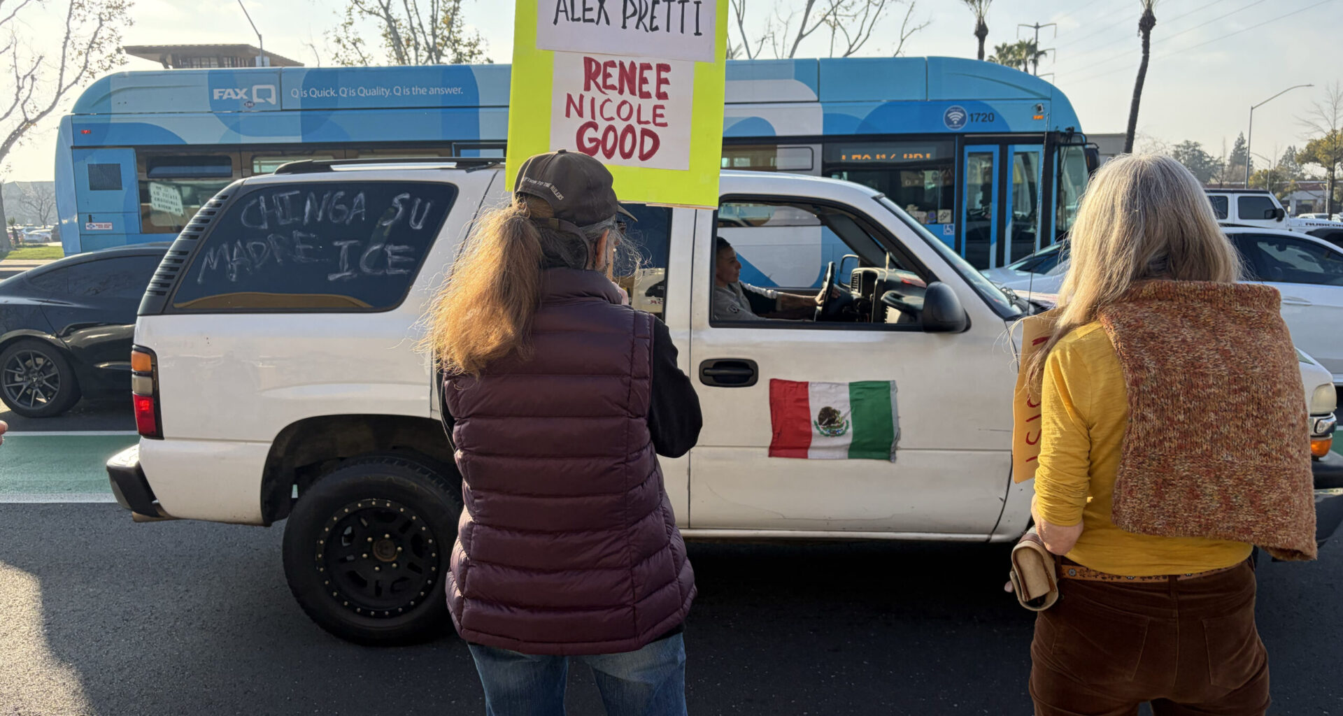 Protestor in SUV drives up and down Herndon and Blackstone blasting Spanish music in solidarity with Anti-ICE demonstration on Feb.7. (Maryanne Casas-Perez/ GV Wire)