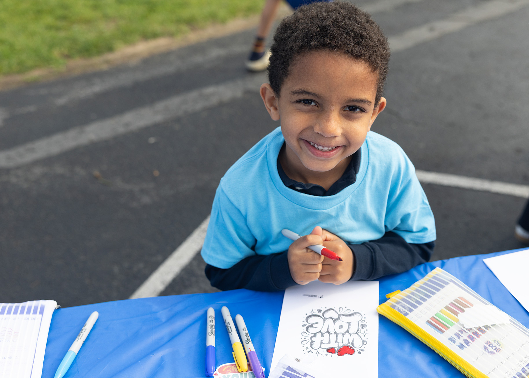 Daniel decorates a card of encouragement (Jon Clark)