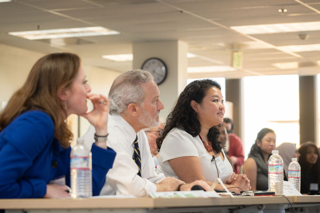 Vera Zakem, Rich Lyons and Adena Ishii look on from the judge's table during the Berkeley Civic Innovation Challenge