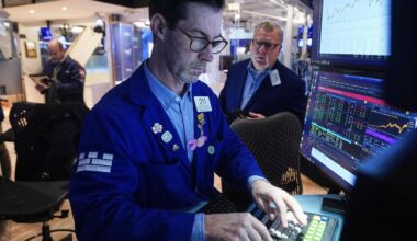 Stocks flirt with a record after the unemployment rate improves