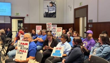 Fresno Unified employees packed the boardroom on Feb. 25 to oppose the district’s plan to layoff over 250 teachers and staff.