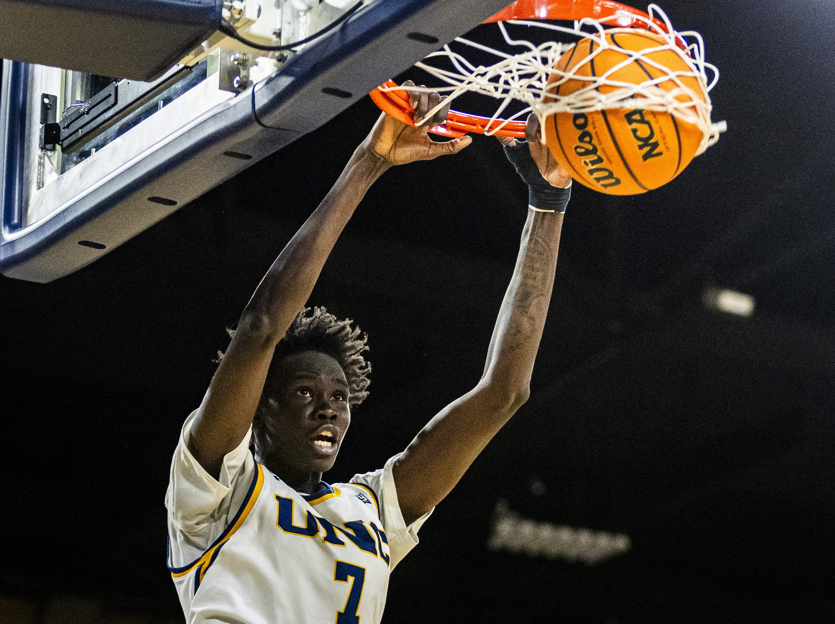 Northern Colorado Bears forward Ring Nyeri (7) dunks the ball...