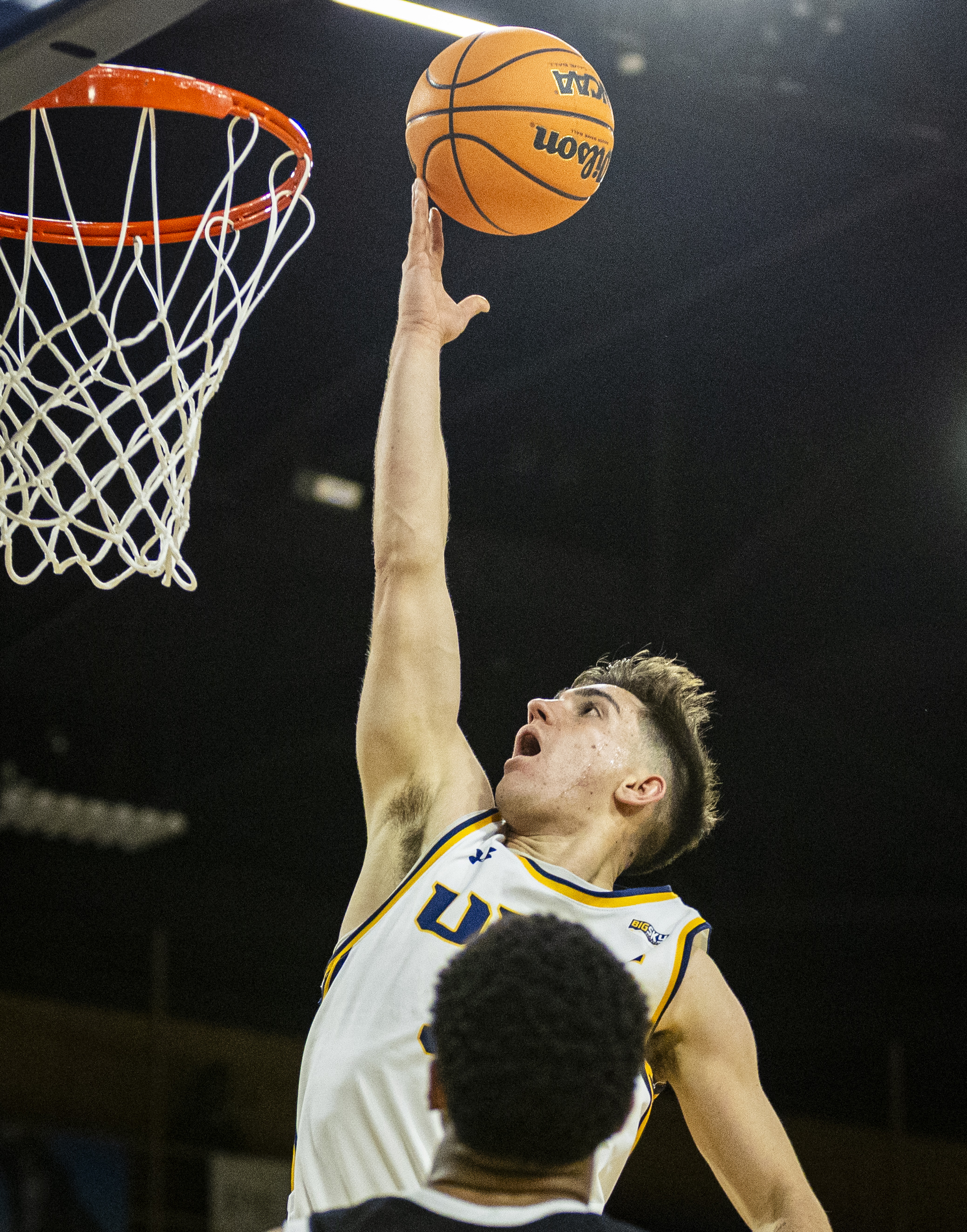 Northern Colorado Bears guard Quinn Denker (35) drives the ball...