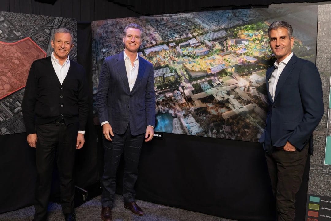 Disney CEO Bob Iger, California governor Gavin Newson, and Disney Parks President Josh D'Amaro stand with the DisneylandForward map.