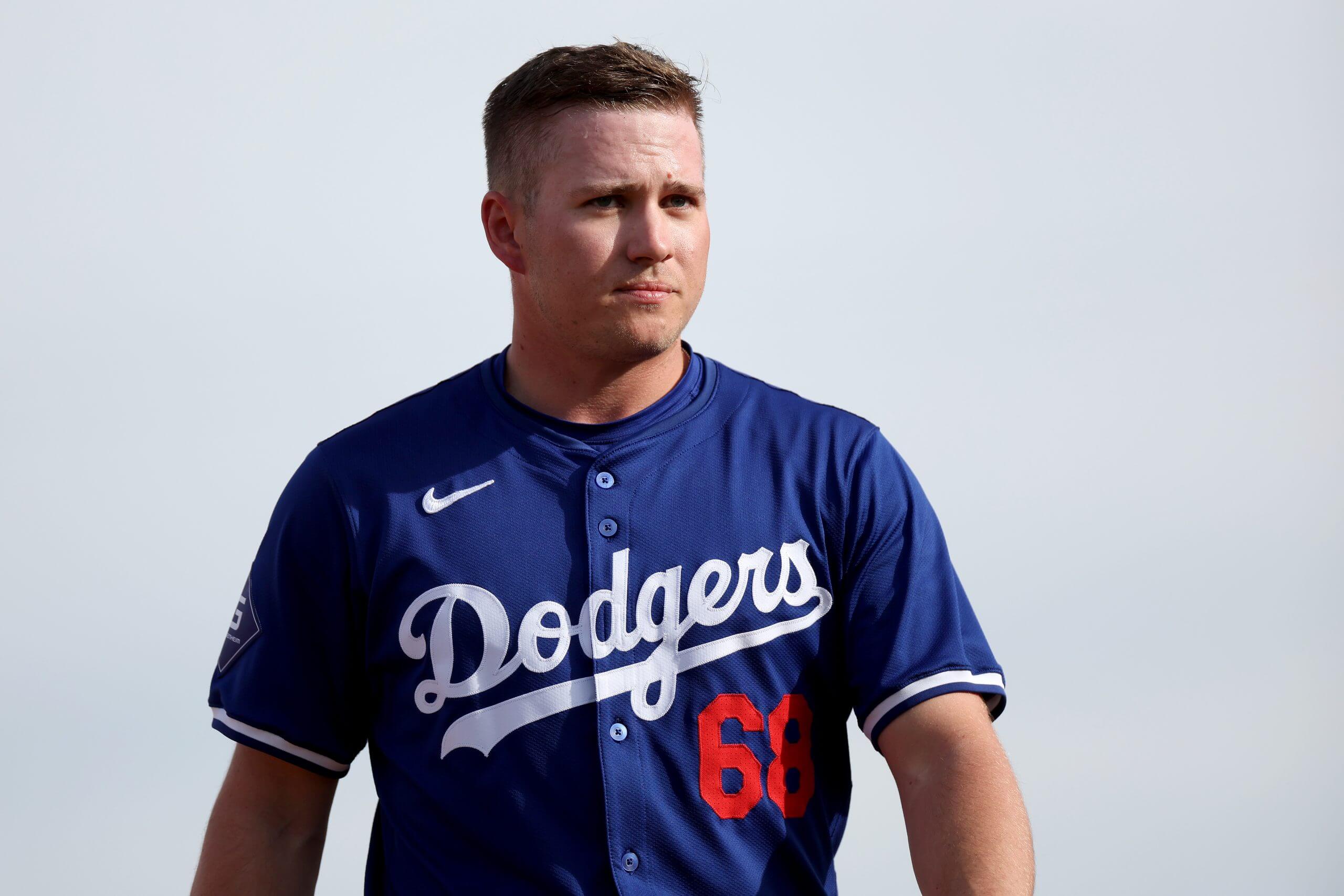 Ryan Ward #68 of the Los Angeles Dodgers looks on against the Los Angeles Angels during a spring training game.. 
