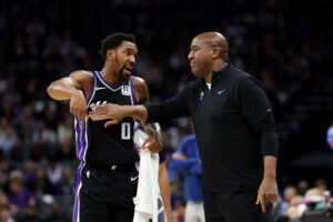 SACRAMENTO, CALIFORNIA - DECEMBER 26: Sacramento Kings head coach Mike Brown talks to Malik Monk #0 during their game against the Detroit Pistons at Golden 1 Center on December 26, 2024 in Sacramento, California. NOTE TO USER: User expressly acknowledges and agrees that, by downloading and/or using this photograph, user is consenting to the terms and conditions of the Getty Images License Agreement. (Photo by Ezra Shaw/Getty Images)