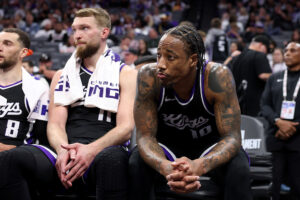 SACRAMENTO, CALIFORNIA - APRIL 16: (R-L) DeMar DeRozan #10 and Domantas Sabonis #11 of the Sacramento Kings sit on the bench at the end of the game in their loss to the Dallas Mavericks in the NBA play-in tournament game at Golden 1 Center on April 16, 2025 in Sacramento, California. NOTE TO USER: User expressly acknowledges and agrees that, by downloading and/or using this photograph, user is consenting to the terms and conditions of the Getty Images License Agreement. (Photo by Ezra Shaw/Getty Images)