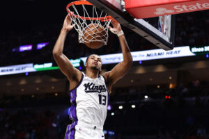 MIAMI, FLORIDA - DECEMBER 06: Keegan Murray #13 of the Sacramento Kings dunks the ball against the Miami Heat during the first quarter of the game at Kaseya Center on December 06, 2025 in Miami, Florida. NOTE TO USER: User expressly acknowledges and agrees that, by downloading and or using this photograph, User is consenting to the terms and conditions of the Getty Images License Agreement. (Photo by Megan Briggs/Getty Images)