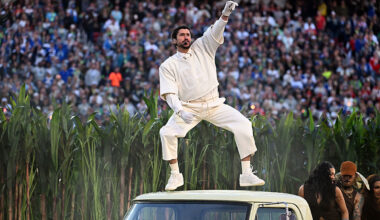 Bad Bunny performing on top of car at Super Bowl 2026
