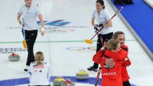 Rachel Homan and Tracy Fleury of Team Canada celebrate after victory in the Women's Bronze Medal match between Team Canada and Team United States.