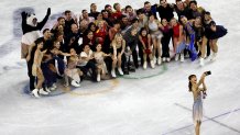 Kaori Sakamoto of Team Japan poses for a selfie with athletes during a Figure Skating Exhibition Gala.