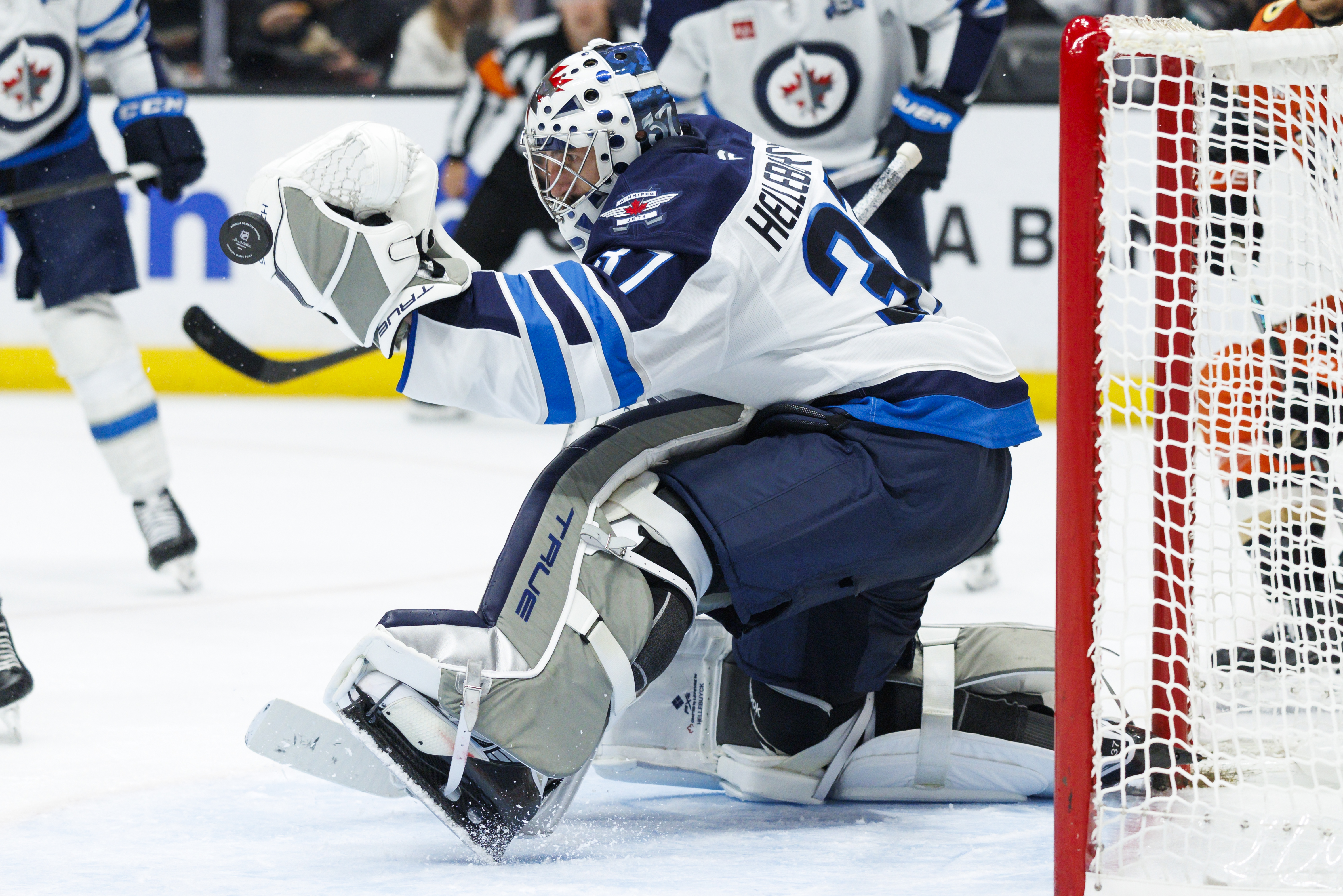 Winnipeg Jets goaltender Connor Hellebuyck makes a save during the...