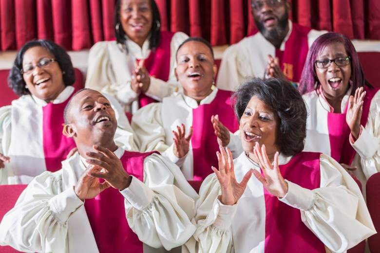 Members of a gospel choir singing and clapping