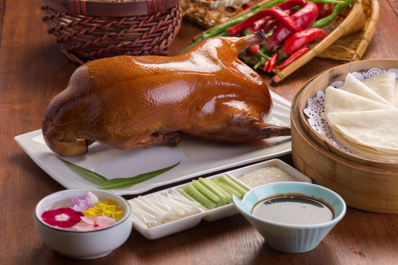 Peking duck served with traditional accompaniments