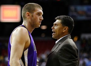 Sacramento Kings head coach Reggie Theus talks to Spencer Hawes #31 during their preseason game against the Los Angeles Lakers at the Thomas & Mack Center October 12, 2008 in Las Vegas, Nevada.