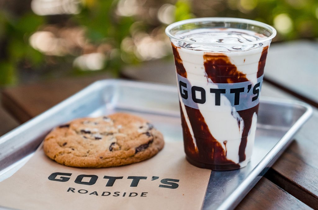 Black and white shake and cookie on a metal tray at Gott’s.