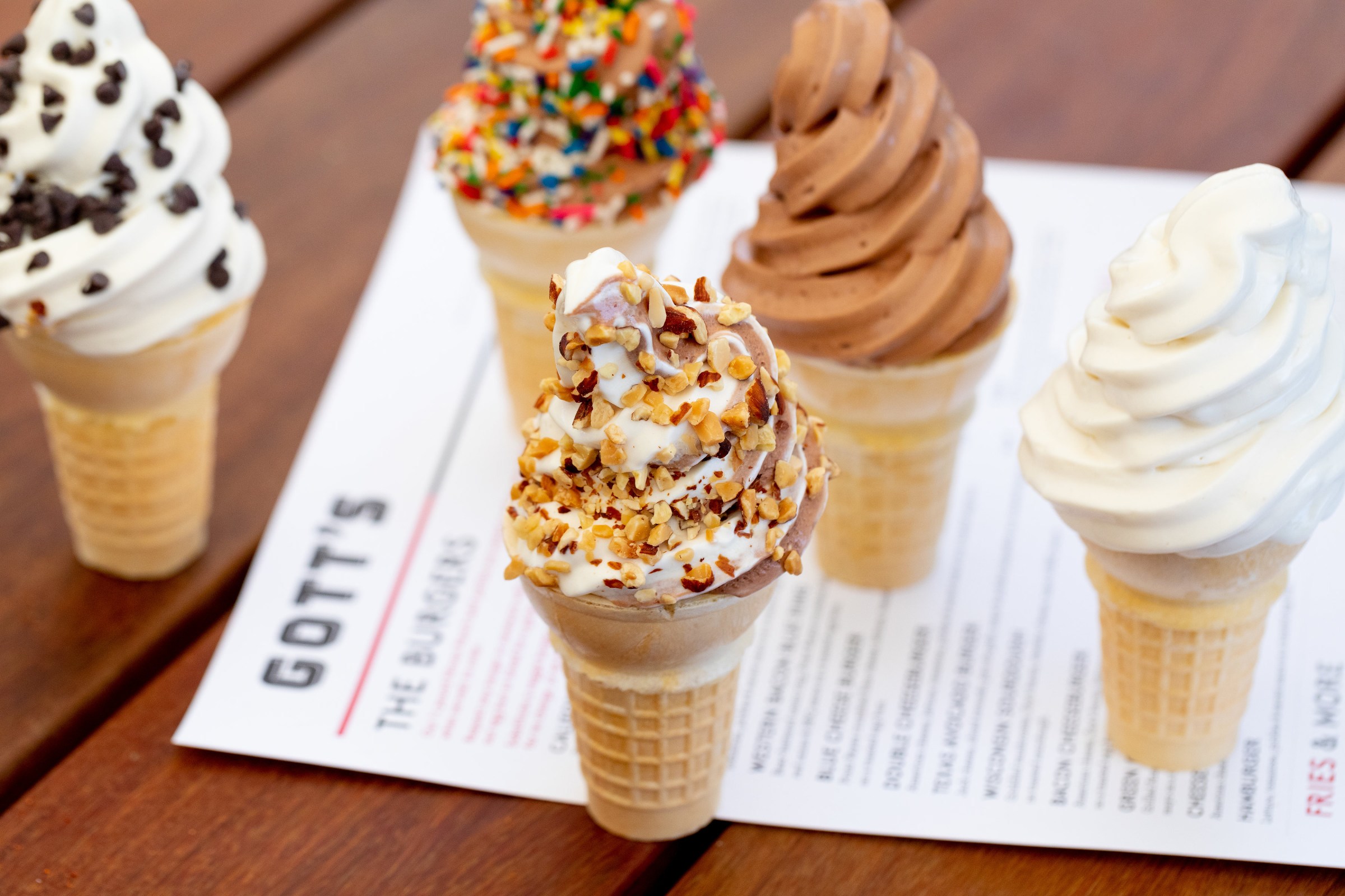 Lineup of soft serve cones on a wood table at Gott’s.