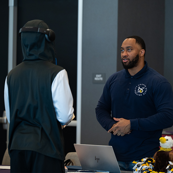 student talking to a college representative