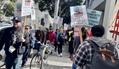 A group of people holding signs